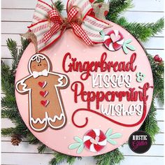 a pink plaque with gingerbread kisses and peppermint wishes