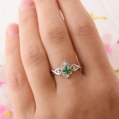 "Vintage style 925 sterling silver art deco emerald promise ring for her, Unique geometric celtic style womens emerald engagement ring WE OFFER UNLIMITED PERIOD INSTALLMENTS PLAN This is a beautiful, stunning, feminine ring that works well for all occasions, styles, and ages. You will love it! Ring information Main stone: Emerald Approximate size: 4x4mm Accent stones: White cubic zirconia Approximate size: 1.5mm (4 stones) Metal type: Silver Metal stamp: 925 Sterling SIlver Customization / Repla Dainty Emerald Jewelry For Promise, Green Dainty Jewelry For Promise, Silver 14k White Gold Promise Ring, 14k White Gold Silver Promise Ring, Classic Green Jewelry For Promise Occasions, Sterling Silver Jewelry For Promise Ring In Diamond White, Emerald Ring With Diamond Accents For Gift, Silver Emerald Cut Ring For May Birthstone, Art Deco Emerald Ring With Diamond For Gift