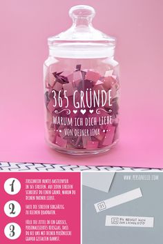 a glass jar filled with lots of pink and white confetti next to a sticker