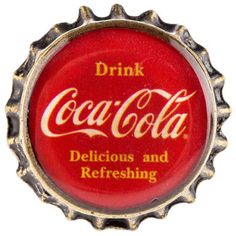 a red bottle cap with the words drink coca - cola delicious and refreshing