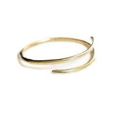 Brass or sterling silver bangle that wraps around wrist. Approximately 2 inches in diameter, can be adjusted by bending tighter or stretching wider. Adjustable Double Band Gold Bangle, Adjustable Minimalist Bangle Bracelet, Brass Bangle Bracelet For Everyday Wear, Handmade Minimalist Brass Bangle, Minimalist Handmade Brass Bangle, Adjustable Gold Bangle With A Modern Twist, Adjustable Bracelet With A Modern Twist, Adjustable Minimalist Brass Bracelets, Minimalist Adjustable Brass Bracelets