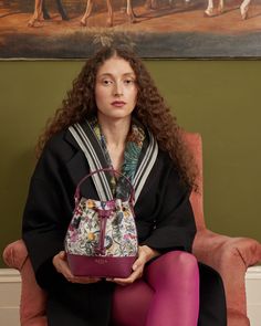 Carry a piece of art with our Floral Engravings Plum Bucket Bag. Crafted from a coated cotton blend canvas with recycled faux leather, this bag features an easy-grab top handle and secure drawstring closure. Perfect for carrying your essentials during museum tours or garden strolls, its luxe gold hardware adds a touch of sophistication to any outing.


Key features:


Outer: 90% Polyester, 10% Polyurethane; Lining: 100% Polyester

Approx. 15 (L) x 21 (H) x 10 (D) cm

Wipe clean with a damp cloth Luxury Red Bucket Bag With Leather Handles, Red Bucket Bag With Gold-tone Hardware For Shopping, Red Bucket Shoulder Bag With Gold-tone Hardware, Fable England, Red Rectangular Bucket Bag With Gold-tone Hardware, Red Crossbody Bucket Bag With Gold-tone Hardware, Luxury Christmas Gifts, Bee Print, Hand Painted Jewelry