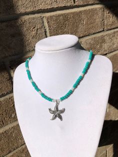 This beaded starfish necklace is made with 6mm turquoise color glass seed beads, 6mm pearl white glass seed beads, a silver plated starfish charm & finished with a stainless steel lobster clasp. Summer Gift Beaded Necklace With Starfish Charm, Handmade Adjustable Starfish Beaded Necklaces, Starfish-shaped Beaded Necklace For Gift, Ocean-inspired Starfish Charm Beaded Necklace, Starfish-shaped Beaded Jewelry For The Beach, Beaded Starfish, Women Necklaces, Starfish Pendant, Starfish Necklace