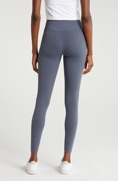 These performance leggings feature a high waist for smoothing coverage and a minimal seam design so they feel like a second skin through every activity. Pull-on style UPF 50+ sun protection 80% nylon, 20% polyester Machine wash, line dry Imported Compressive Tights With Contoured Waistband For Pilates, Sporty Compression High-waisted Leggings, Compressive Athleisure Tights With Light Support, Sporty Compression High-cut Leggings, High Rise Tight Athleisure Leggings, Tight High Rise Athleisure Leggings, High Rise Sporty Tights For Pilates, Sporty High Rise Tights For Pilates, High Stretch Smoothing Activewear With High-cut Leg