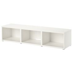 a white shelf with three open compartments