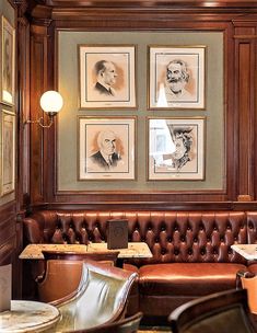 an old fashioned restaurant with leather booths and pictures on the wall above them, along with chairs