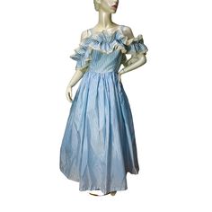 This 80s formal gown reminds me of a southern belle dress or Little Bo peep. It's made of a baby blue and white striped fabric that feels like nylon or polyester. It's lightweight.  The bodice is lined and boned in the front and on the sides. There is a white nylon zipper up the back.  There are two shoulder straps and a double layered ruffle that is attached in front and back but open on the sides so it can fall over the shoulders gracefully.  If you would like it a little higher or tighter it can be fixed fairly easily by pulling the threads tighter and securing with a few stitches.  There is a one-layer net crinoline sewn to the lining. There are no labels present.  Good condition but there are belt loops and the belt is missing. Measurements Bust 36" Waist 27" Lenght 48.5" from under a Vintage Off-shoulder Dress With Ruffles, Spring Victorian Dress For Party, Summer Formal Vintage Ruffled Dress, Spring Vintage Dress With Ruffles For Formal Occasions, Fitted Victorian Dress For Spring Evening, Spring Formal Vintage Dress With Ruffles, 80s Formal, Southern Belle Dress, Vintage Runway