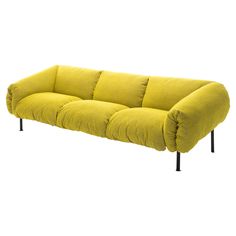 a yellow couch sitting on top of a black metal frame legs and armrests