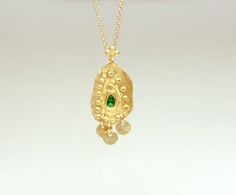 Boho gold necklace 9k 14 k Solid gold necklace with green emerald May birthstone, Yellow gold necklace, Delicate Pendant, Gift for her This solid gold necklace has a rustic textured and is set with a natural green emerald. The pendant has a delicate granulation all around it. This pendant is delicate but has a lot of character, and will upgrade any outfit you'll wear, for everyday use, as for special occasions The pendant can be ordered without the chain too. An excellent choice for anniversary Gold Plated Emerald Necklace In Fine Jewelry Style, Gold Plated Emerald Necklace Fine Jewelry, Fine Jewelry Gold Emerald Pendant Necklace, Yellow Gold Emerald Necklaces As A Gift, Gold Necklace With May Birthstone Gemstone, 14k Gold Pendant Necklace For May Birthstone, 14k Gold Necklace With May Birthstone Pendant, Gold Jewelry With Coin Pendant For May Birthstone, Gold Emerald Necklace As Gift