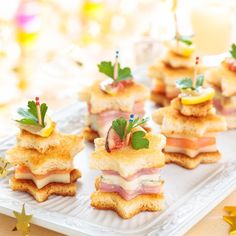 small appetizers are arranged on a white plate