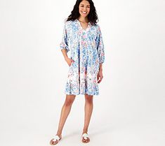 Who says summer has to be all shorts and tees? (Not us!) Mix up your fun-in-the-sun mojo with this pretty printed dress boasting a frilly ruffle trim. Its elevated yet relaxed style fits right in with your minimal effort plans without sacrificing warm-weather comfort. What can we say -- one-piece dressing is one-derful! From the Tolani Collection. Spring V-neck Beach Dress, Casual V-neck Sundress For Summer Outings, Breezy Beach Dress For Spring, Summer Dresses With Ruffles In Relaxed Fit, Relaxed Fit Ruffle Dress For Day Out, Relaxed Fit Ruffled Dress For Day Out, Relaxed Fit Dress With Ruffles For Day Out, Spring Beachwear Dresses With Ruffles, Tiered Summer Dress For Vacation