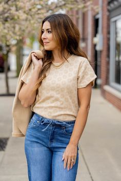 This tee is one-of-a-kind! With the addition of the unique textured flowers this is sure to have you turning heads. Pair with shorts or a skirt in the warmer months or layer with a blazer, cardigan, or jacket in the cooler ones!95% Polyester & 5% Spandex Beige Knit Top For Spring Day Out, Spring Textured Knit Casual Top, Spring Textured Knit Top For Day Out, Textured Knit Tops For Spring Day Out, Textured Knit Tops For Casual Spring Gatherings, Spring Cotton Textured Knit Tops, Short Sleeve Knit Top For Fall Day Out, Fall Short Sleeve Knit Top For Day Out, Casual Jacquard Knit Top For Spring