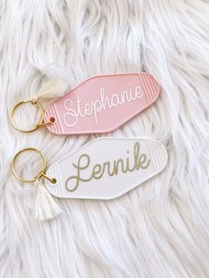 Personalized motel style keychains make cute gifts for your Teen, Sweet 16 Birthday Gift, Bride Gift, Girls Scouts and much MORE! Each keychain has a white fringe tassel.  ♡  Acrylic Keychain with name only. ♡ 1 acrylic keychain with white fringe tassel - no other items are included. ♡ Material: Metal. Metal Keychain with Acrylic Keychain Size: 3.5" x 1.75" Customized Pink Keychains, Cute Pink Keychains As Gifts, Cute Pink Keychain For Gift, Cute Pink Keychains For Gifts, Cute White Keychain For Gift, Personalized Pink Keychains As Gifts, Personalized Pink Keychains For Gifts, Cute Pink Personalized Gift Keychains, Cute White Keychains For Personal Use