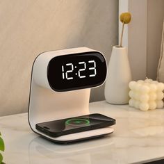 an alarm clock sitting on top of a table