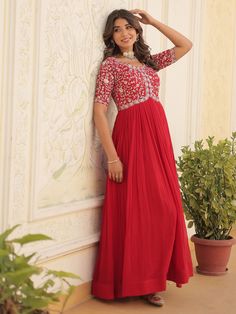 Introducing our enchanting red embroidered georgette wedding wear gown, a stunning addition to your wardrobe for any special occasion. This fully stitched gown is available in sizes XS to XXL, ensuring a perfect fit for every body type. With zari embroidery and sequin work, this gown exudes luxury and elegance, making you stand out at weddings, festivals, receptions, or any event.
This red reception wear gown includes a 3.5-meter flair and a gown length of 54 inches, giving you a beautiful silho Anarkali Embroidered Maxi Dress For Reception, Anarkali Maxi Dress With Floral Embroidery For Wedding, Resham Embroidered Maxi Dress For Wedding, Semi-stitched Floor-length Embroidered Dress For Reception, Wedding Chikankari Embroidery Maxi Dress, Festive Chikankari Embroidered Maxi Dress For Wedding, Semi-stitched Embroidered Floor-length Dress For Reception, Festive Floor-length Dress With Resham Embroidery, Red Georgette Dress With Zari Work