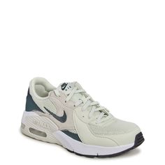 These women's Nike Air Max Excee sea glass/vinathe green/white athletic sneakers feature an iconic design with a contemporary flair. These fashion athletic shoes are crafted with mesh, synthetic and leather for long-lasting use, supportive overlays, and lace-up closure with blind eyelets for an adjustable fit. Elongated design lines and distorted proportions on the upper along with Air Unit in the heel offer a modern look. Foam midsole and foam and rubber outsole pods give lightweight comfort and durability. | Nike Women's Air Max Excee Running Shoe in Sea Glass/Vintage Green/White Size 9 Medium Shoes For Women Sneakers & Athletic, Cute Gym Shoes, Fashion Athletic Shoes, Cute Running Shoes, Nike Gym Shoes, White Athletic Sneakers, Shoes For School, Air Max Excee, Sports Outfit