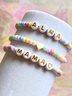 Colorful bead bracelets are so stunning and chic and makes a great gift ! Customized just for you ❣️ They are perfect for mixing, matching and stacking.  This listing is for One bracelet. You can choose name/ heart/mama style or all of them.  -4mm seed beads - 4mm gold filled bead  - 7mm letter of your choice  Can be personalized. 🤍 ⭐️ Customise a bracelet with your name or someone you love name on it ! Special orders are always welcome ❣️ Bracelets are made with transparent stretchy quality je Colorful Bead Bracelets, Kids Bracelet, Mini Bracelet, Bracelet Rainbow, Bracelet Heart, Seed Bead Bracelet, Kids Bracelets, Wedding Jewelry Bracelets, Name Bracelet