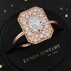 a diamond ring sitting on top of a black box