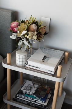 a table with books and flowers on it