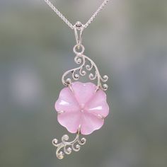 An elegant, pink flower is hand-carved from a stone of dyed quartz, hanging at the center of a length of box chain. India's Shubhra Singh designs this wonderful pendant necklace, crafted with curling sterling silver vines by local artisans. Pink Jade Jewelry Gift, Pink Jade Jewelry As A Gift, Pink Jade Jewelry For Gift, Pink Sterling Silver Flower-shaped Jewelry, Pink Jade Jewelry With Natural Stones, Flower Shaped Sterling Silver Jewelry With Natural Stones, Sterling Silver Flower Jewelry With Natural Stones, Pink Engraved Necklace For Gift, Jade Flower-shaped Jewelry Gift