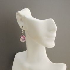 "Sparkling pink earrings. Rhodium plated pink glass teardrops with rope trim. The glass drop earrings measure 1 1/4\" long and the ear wires are sterling silver. A dazzling shade of cotton candy pink. Perfect for your bridesmaid gift. * rhodium plated teardrop (13 x 10mm) * sterling silver ear wires The earrings will arrive gift boxed. The matching necklace, as shown in picture #5, is available in my shop at: https://www.etsy.com/listing/193511812/light-pink-necklace-pink-bridesmaid?ref=shop_hom Nickel Free Teardrop Earrings For Wedding, Hypoallergenic Teardrop Crystal Earrings For Party, Hypoallergenic Teardrop Crystal Earrings For Formal Occasions, Single Pink Earring For Anniversary, Pink Pierced Jewelry For Formal Occasions, Pink Single Earring For Anniversary, Sterling Silver Nickel Free Teardrop Earrings For Wedding, Pink Drop Earrings For Anniversary, Pink Hypoallergenic Earrings For Formal Occasions