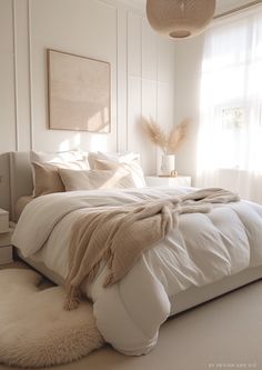 a bed with white sheets and blankets in a bedroom next to a window, rugs on the floor