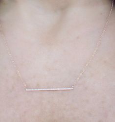 "This dainty 14k gold diamond bar necklace is cute and sparkles beautifully. The bar is about 1 1/4\" long. I've added loops at the end of the necklace so you can wear it anywhere from 16\"-18\" which makes it great for layering! Makes for a great gift or just for yourself! *Diamond weight 0.07cts *Solid 14k gold Upgrades for FedEx/UPS guaranteed 2-day delivery are available and can be selected prior to checkout without separate invoicing. It is generally not an issue, but the USPS cannot guaran Minimalist Diamond Accents Bar Necklace As Gift, Minimalist Diamond Accents Bar Necklace Gift, Minimalist Bar Necklace With Diamond Accents, Minimalist Bar Necklace With Diamond Accents As Gift, Minimalist Bar Necklace With Diamond Accents For Gift, Minimalist Bar Necklace With Single Cut Diamonds For Gift, Diamond Bar Necklace With Diamond Accents As Gift, Yellow Gold Bar Necklace With Diamond Accents As Gift, Elegant Single Cut Diamond Bar Necklace For Gifts