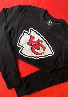 47 Kansas City Chiefs Black Imprint Long Sleeve T Shirt - 48001461 Kansas City Chiefs Sweater, Kansas City Chiefs Cricut Shirt, Chiefs Super Bowl Shirts, Graphic Print Crew Neck Top For Fans, Fall Fan Apparel T-shirt With Logo Print, Collegiate Black T-shirt For Streetwear, Black Logo Print T-shirt For Fall, Long Sleeve Graphic Print T-shirt For Sports Fans, Collegiate Black T-shirt For Football Season