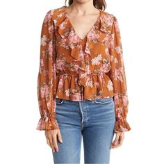 Spring Florals Are Here! The Deets: Ruffle Vneck Floral Blouse | Size Xs | Color: Burnt Orange + Gorgeous Pink/White Floral Print Throughout | Perfectly Paired For The Office W. A Pencil Skirt Or Pants Or Casual Cute For Date Night Or Brunch W. Your Fav Denim | Features: Ruffle V Neck + Sheer Balloon Sleeves + Elastic Drawstring Waist + Lined Throughout Minus The Sleeves + Fits Up To A Small + Machine Washable On Delicate | 17” Bust + 22” Length | 100% Polyester | Contact For Questions | No Trad Fall V-neck Top With Ruffle Hem, Feminine V-neck Top With Ruffle Hem, Fall V-neck Ruffled Tops, Feminine V-neck Top For Fall, Spring V-neck Blouse With Ruffle Hem, Feminine V-neck Blouse For Brunch, Chic V-neck Floral Print Top, Pink V-neck Blouse With Ruffles, Spring V-neck Top With Ruffle Hem