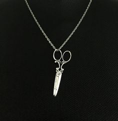 "Absolutely adorable necklace  for a hair stylist !  It light in weight, and fun to wear. Please choose silver or gold color. length : 20 inch  ,  pendant size : 2.5 inch  Silver plated . Need a different length just write it to me in the \"message to the seller\" box of the order form. **LIMITED SUPPLY** All of our jewelry comes wrapped and ready for gift giving! To see more, please visit my shop at http://www.etsy.com/ca/shop/BadassjewelryToronto" Scissor Necklace, Hair Stylist Gifts, Chakra Necklace, Protection Stones, Order Form, Personalized Necklace, Indian Jewelry, Jewelry Care, Crystal Necklace