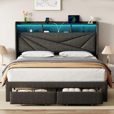 a bed with two drawers underneath it and a night stand on the headboard above it