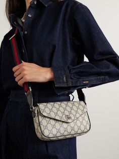 Gucci's 'Ophidia' bag was first introduced in the 2018 'Cruise' collection and has continued to evolve ever since. This version has been made in Italy from the house's iconic 'GG Supreme' coated-canvas with leather trims. It's sized to hold smaller essentials like your phone, wallet, and lipstick. Gucci Beige Crossbody Satchel, Gucci Shoulder Bag With Detachable Strap In Monogram Canvas, Gucci Monogram Canvas Shoulder Bag With Detachable Strap, Beige Gucci Bag With Detachable Strap, Designer Beige Flap Bag With Removable Pouch, Gucci Coated Canvas Satchel Shoulder Bag, Gucci Coated Canvas Crossbody Shoulder Bag, Gucci Beige Bag With Detachable Strap, Gucci Bags With Detachable Strap