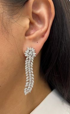 Looking for a pair of earrings that exude elegance and sophistication? Look no further than marquise and round diamond drop earrings! These stunning earrings are perfect for any occasion, whether you're dressing up for a formal event or adding a touch of glamour to your everyday look. The marquise and round diamonds are expertly set in a delicate drop design, creating a truly breathtaking effect. The diamonds sparkle and shine in the light, making these earrings a true statement piece. These earrings feature round and marquise diamonds weighing a total of 6.52 cts and graded E-F in color and VS in clarity set in 18k white gold. Drop Design, Marquise Diamond, Diamond Drops, Stunning Earrings, Drop Earring, Drops Design, Diamond Drop Earrings, Chicago Il, Round Diamond