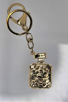 Gorgeous Large Perfume Rhinestone Key chain, This beautiful key chain has a perfume bottle surrounded in rhinestones. Take a look. Lv Key Chains, Louis Vuitton Coin Purse Keychain, Louis Vuitton Accessories Key Chains, Luxury Bag Charm With Keychain, Rectangular Bag Charm With Key Clip, Pink Faux Fur, Faux Fur, Key, Perfume Bottles