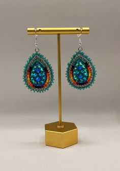 Large indigenous style beaded tear drop earrings.  These will only come in turquoise and red.  Dress them up or down, they will complete any outfit.  Super sparkly, lightweight and hypoallergenic.  These can be customized for clip-ons. Unique Beaded Teardrop Jewelry, Teardrop Beaded Jewelry For Festivals, Turquoise Teardrop Beaded Earrings As Gift, Turquoise Teardrop Beaded Earrings For Gifts, Handmade Teardrop Earrings For Festival, Beaded Dangle Teardrop Earrings For Festivals, Handmade Turquoise Teardrop Earrings Southwestern Style, Turquoise Teardrop Beaded Bohemian Earrings, Handmade Turquoise Teardrop Earrings In Southwestern Style