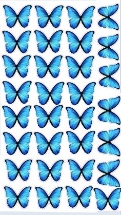 a large group of blue butterflies flying through the air