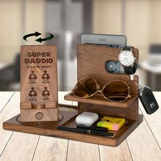 a wooden case with sunglasses and other items