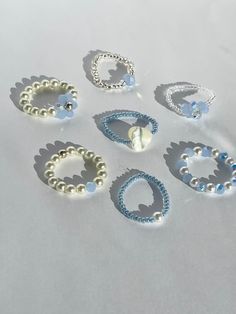 (items are shipped between 1-2 days)   Cute beaded stretchy rings made with blue beads and/ or pearls 💗I recommend avoiding water and keeping it stored away when not being worn to maintain its quality. Preppy Seed Bead Rings, Pearl Beaded Ring, Ring Ideas With Beads, Aesthetic Beads Ring, Cute Seed Bead Rings, Cute Diy Rings, Bracelets Handmade Beaded Diy Jewelry, Blue Bead Bracelet Ideas, Cute Pearl Bead Ideas