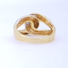 A wonderful white and yellow gold plated costume ring in excellent condition. Knot design. Size 9.25 The top measures approximately 18 x 16 x 7 mm US SHIPPING: US orders over $35 or for 3 or more items ship free via first class mail. Orders over $150 receive a free priority mail upgrade. Expedited shipping is available. SHIPPING OUTSIDE THE US: We combine shipping on multiple item orders. Expedited shipping is available. Enter code FREESHIPINT for free shipping on orders over $200 GIFTS: Request Classic Gold Cluster Open Ring, Classic Gold Cluster Ring With Open Design, Gold Classic Cluster Open Ring, Gold Bypass Ring With Diamond Accents For Gift, Gold Bypass Ring With Diamond Accents As Gift, Gold Dome Ring With Diamond Accents, Gold Diamond Cut Bypass Ring Gift, Gold Signet Ring With Diamond Accents For Anniversary, Formal Gold Dome Ring With Diamond Accents