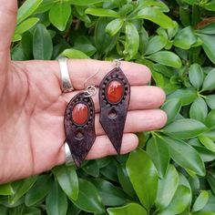 Boho Leather Earring with Brown Agate Stone Setting. 100% handmade vegetan leather earring design with brown agate stone setting. Each earring is finished with handstitching. Known as the stabilizer, Agate is the stone to call on for support when you need stability and grounding in your life. Along with its supportive energy, the Agate stone has been long admired for its incredible beauty. Agate has a dreamy quality with signature bands made up of mineral deposits layered in a perfectly circular Brown Agate, Leather Earring, Boho Leather, Black Skulls, Stone Setting, Green Agate, Agate Stone, Leather Earrings, Scarf Hairstyles