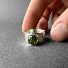 Natural Green Tourmaline Silver Ring - Green Chrome Tourmaline Ring Size 7 - Completely Handmade & Silver Gemstone: Green Tourmaline (Chrome Tourmaline)  Metal: Pure and 925 Sterling Silver Stone Cut: Cabochon Stone Size: 9.0 mm x 9.0 mm - 0.35 in - 0.35 in Weight: 6.22 grams (31.1 carats) total weight of stone and silver. For ring orders, ring resizing is free. Chains are gifts for necklace orders..  Note: We don't use any filters for photos. The details may not be clear. Feel free to contact us with any questions, special orders or additional photo or video requests. We will be happy to provide more information! :) WORLDWIDE FedEx, UPS or TNT EXPRESS MAIL SERVICE (Delivery time: 1 - 5 business days.) LAYAWAY PAYMENT PLAN is available. ABOUT THE TOURMALINE It is a precious stone with a ve Silver Ring Green Stone, Silver Tourmaline Emerald Ring, Silver Tourmaline Birthstone Ring, Tourmaline Birthstone Ring With Bezel Setting, Tourmaline Birthstone Rings, Chrome Tourmaline, Green Chrome, Dope Jewelry, Jewelry Lookbook