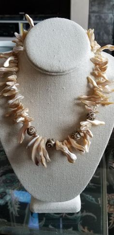 Natural Beachy Shell Necklace with Carved Soapstone, Matching Earrings Sterling Silver Ear Wires.   Great necklace for a beach vacation or just for summer!  Large slivers of natural shell with clear quartz round beads and carved soapstone round beads.    Pretty heart clasp, 19 inches long.  Cool and classy!   Matching earrings with topaz Swarovski bicone crystals and sterling silver ear wires included! Go ahead, be different!  This piece is unique and, as usual, one of a kind!   Sure to garner the wearer many compliments! Jewelry Matching, Necklace Shell, Eyeglass Necklace, Cat Bead, Butterfly Bracelet, Castle Rock, Eyeglass Chain, Skull Jewelry, Summer Necklace