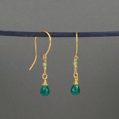 A stunning pair of minimalist style green agate and peridot 18ct gold plated sterling silver drop earrings. These lovely earrings feature a mixture of gemstones and gold plated silver nuggets; they are ideal for wearing on a night out as they are for daytime wear and are extremely comfortable and easy to wear. Green and gold tones are so versatile and these earrings are so stylish. https://www.etsy.com/uk/shop/yvonnehendersonjewel?ref=seller-platform-mcnav Green Onyx Drop Earrings, Green Onyx Earrings For May Birthstone, Green Minimalist Pierced Earrings, Elegant Green Onyx Dangle Earrings, Elegant Green Onyx Drop Earrings, Minimalist Green Pierced Earrings, Elegant Green Onyx Dangle Jewelry, Minimalist Yellow Gold Earrings For May Birthstone, Green Minimalist Drop Earrings