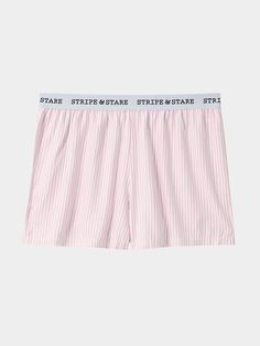 Inspired by the classic stripe shirt, and the it-girls’ ‘wear your boyfriends boxers out’ trend of the season, the Soft Brushed WovenBlue Stripe Pyjama Shorts are classic and cool at the same time. Made from 100% EcoVero Viscose from Lenzing – ‘the new standard in eco-responsible viscose'. Derived from certified renewable wood sources using an eco-responsible production process. Up to 50% lower water impact than general viscose. Iron garment for reshape. Sustainable nightwear designed by women, for women. One tree planted with every order. Model wears a size M. Mainline - 95% TENCEL™ Modal, 5% Elastane. Lace: 91% Nylon, 9% Elastane. B-Edit - 74% TENCEL™ Modal, 19% SeaCell™ and 10% Roica V550. Soft Brushed Woven - 100% EcoVero Viscose from Lenzing. We recommend washing on a cool, 30 degree Cap Fashion, Striped Pyjamas, Lingerie Sleepwear, Pajama Shorts, Girls Wear, Pink Stripes, Striped Shirt, Nightwear, Swimwear Tops