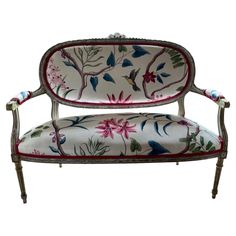 an ornately decorated bench with flowers on it