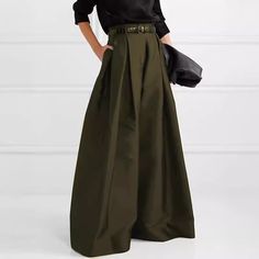 Loose high-waisted solid color wide-leg pants offer effortless style and comfort. With a relaxed fit that cinches at the waist and flows into a flattering wide leg, these pants are versatile for both casual and dressed-up looks. Green Military Style Pants For Fall, Military Style Green Pants For Fall, Green Military Pants For Fall, Fitted Olive Pants For Spring, Pleated Khaki Bottoms For Fall, Khaki Pleated Bottoms For Fall, Fall Pleated Khaki Bottoms, Spring Military Style Workwear Pants, Spring Military Workwear Pants