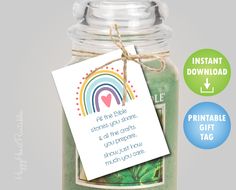 a jar filled with green candles and a tag on the label that says, printable gift tags