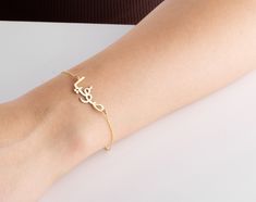 "This 14k solid gold Arabic name bracelet is a perfect birthday gift for a Muslim friend, mother, anniversary, birthday, new mom, bridesmaid, teenage girl, wedding, engagement, graduation, valentine's day, baby shower, bridal shower! Also, this real gold Arabic nameplate bracelet would make a great gift for bride, grandma, girlfriend, best friend, daughter or a treat for you! This personalised Islamic name jewellery has been produced with high quality 14k/8k solid gold or 925k solid silver and available in silver, gold, rose, white gold, yellow gold and rose gold colour.  FEATURES: * Custom Arabic name bracelet * chain in different lengths * great for daily wear * hypoallergenic * nickel-free, lead-free & cadmium-free * handmade in the UK * arrives in gift box * can include your gift messa Elegant Engraved Name Bracelet For Birthday, Elegant Gold Bracelet For Mother's Day Gift, Elegant Adjustable Gold Bracelet For Birthday Gift, Elegant Adjustable Gold Bracelet For Birthday, Elegant Custom Name Bracelet For Birthday Gift, Yellow Gold Charm Bracelet As Gift, Elegant Customized Name Bracelet For Birthday Gift, Elegant Customized Name Bracelet For Birthday, Elegant Engraved Name Bracelet For Mother's Day