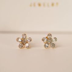 Celebrate Mother's Day with an unforgettable offer! Don't miss out on this special opportunity! Diamond flower earrings are a captivating jewelry design that often showcases the brilliance of diamonds in a floral-inspired motif. Design: Diamond flower earrings feature a central diamond or cluster of diamonds arranged in the shape of a flower. The design can vary from delicate and understated to bold and intricate, depending on the size and arrangement of the diamonds. Diamonds: The diamonds used in these earrings are usually of high quality, chosen for their clarity, cut, and brilliance. They may be round, princess, pear, marquise, or any other cut that mimics the petals of a flower. The diamonds may be set in prongs, bezels, or pavé settings to create the desired floral effect. Floral Mot Diamond Flower Earrings, Motif Design, Pave Setting, Diamond Flower, Gold Collection, Flower Earrings, Floral Motif, Diamond Jewelry, Necklaces Bracelets