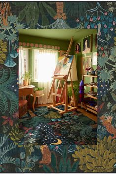 an artist's easel in the corner of a room filled with plants and paintings